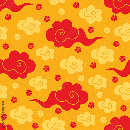 Chinese seamless pattern of with gold and red clouds on a Golden background. Festive traditional Asian ornament of clouds, waves and Sakura. Hand drawn vector illustration in oriental style