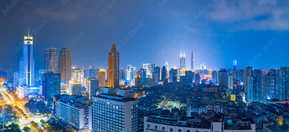 Skyline scenery of high-rise buildings at night in Luohu District, Shenzhen, China