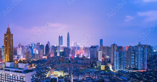 Skyline scenery of high-rise buildings at night in Luohu District, Shenzhen, China © hu