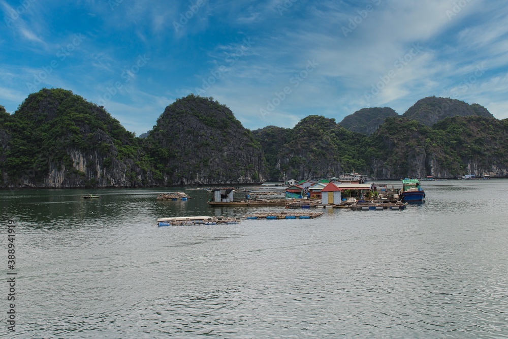 A floating fishing village in between the thousand islands of Halong Bay in Vietnam