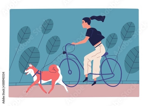 Young woman riding bicycle in park with dog on leash. Female character spendi...