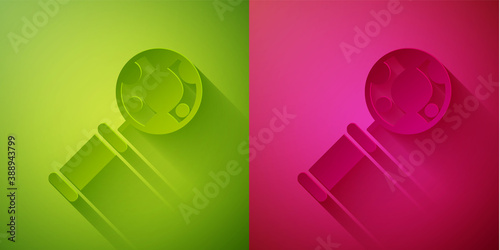 Paper cut DNA research, search icon isolated on green and pink background. Magnifying glass and dna chain. Genetic engineering, cloning, paternity testing. Paper art style. Vector.