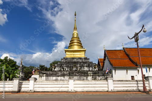 The Golden Stupa in Lanna architecture style of Wat Phrathat Chang Kham Worawihan temple in Nan Province, Thailand 