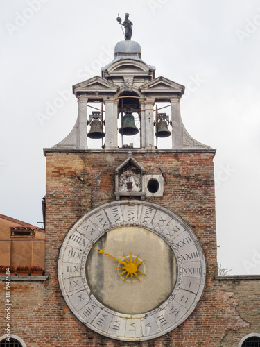The bell-gable and clock of San Giacomo di Rialto which, according to tradition, is the oldest church in the city, supposedly consecrated in the year 421 - Venice, Veneto, Italy photo