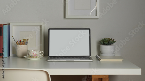 Workspace with laptop, books, stationery, decorations and copy space, clipping path