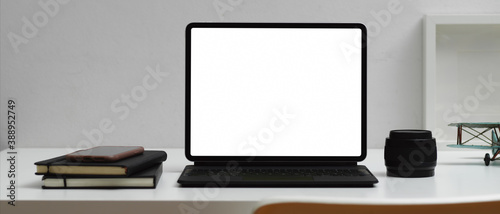 Home office desk with digital tablet, notebooks and decorations, clipping path