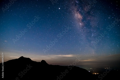 Amazing stary night above the mountain range in Doi Luang National Park, Thailand. © Klanarong Chitmung
