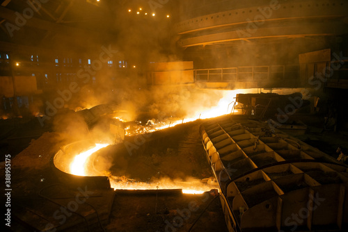 blast furnace iron tapping. Hot steel is poured into another pan