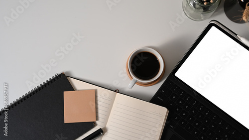 Workspace with digital tablet, coffee cup, notebook and copy space, clipping path
