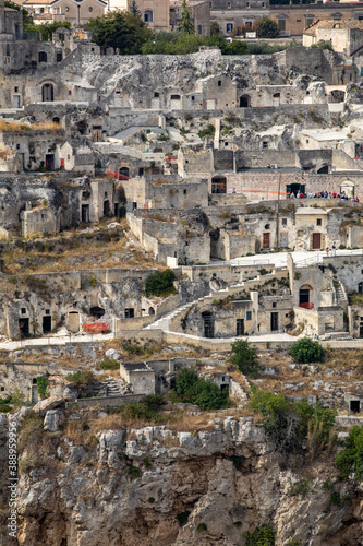 Panoramic view of Sassi di Matera a historic district in the city of Matera, well-known for their ancient cave dwellings from the Belvedere di Murgia Timone,  Basilicata, Italy #388959956
