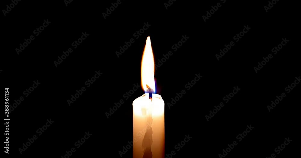close-up of candle burn with glow flame fire sparkle on black background, with copy space for text, holiday event close-up of candle burn with glow flame fire sparkle on black background, with copy space for text, holiday event