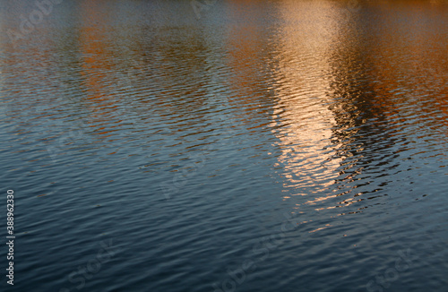 Residential buildins reflecting in water.