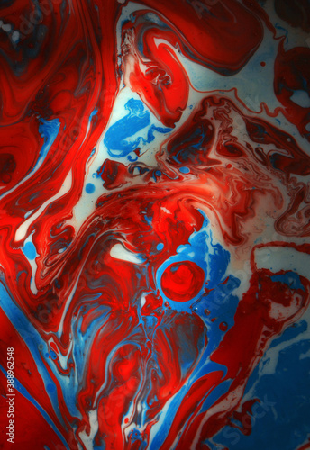 Abstract photographs of color mixing of water, acrylic,oil for use as background image. Acrylic texture with beautiful pattern, close up multi color background photo.