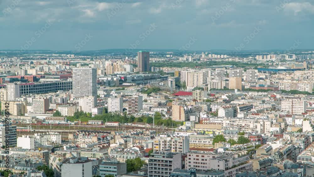 Panorama of Paris aerial timelapse, France. Top view from Sacred Heart Basilica of Montmartre (Sacre-Coeur). Sunny day with blue cloudy sky. Panorama of Paris aerial timelapse, France. Top view from Sacred Heart Basilica of Montmartre (Sacre-Coeur). Sunny day with blue cloudy sky.