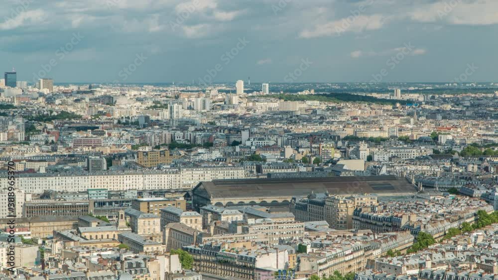 Panorama of Paris aerial timelapse, France. Top view from Sacred Heart Basilica of Montmartre (Sacre-Coeur). Sunny day with blue cloudy sky. Panorama of Paris aerial timelapse, France. Top view from Sacred Heart Basilica of Montmartre (Sacre-Coeur). Sunny day with blue cloudy sky.
