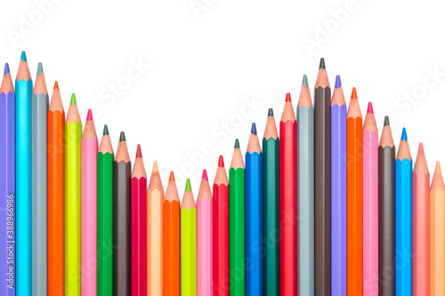 Color pencils arranged in a sine wave (sinusoid). Sinusoidal shape of wooden sharp colorful pencil crayons isolated on white background. Analysis concept
