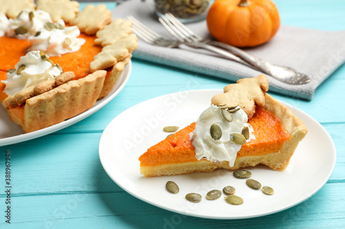 Delicious homemade pumpkin pie on light blue wooden table