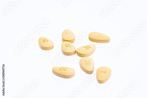 Brown pills pills isolated on white background photo