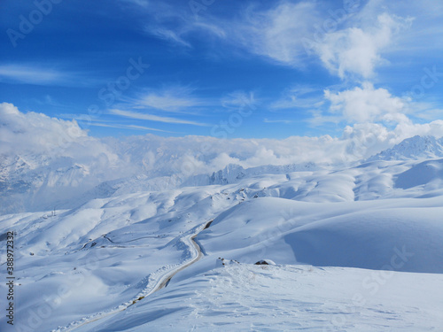 a white landscape, winter season, snowy mountains  © Emin