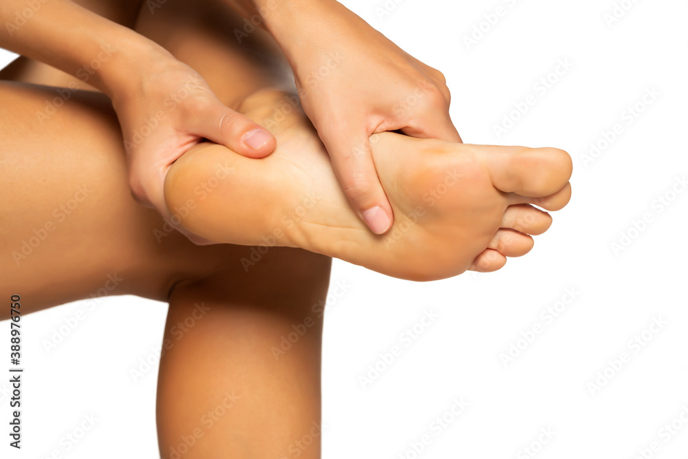 Painful female foot, isolated on white background.