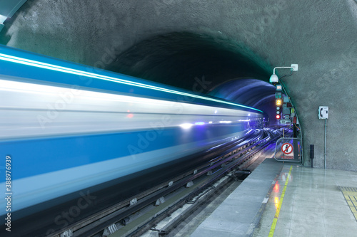 Motion blur of a train coming out of subway tunnel at Metro de Santiago