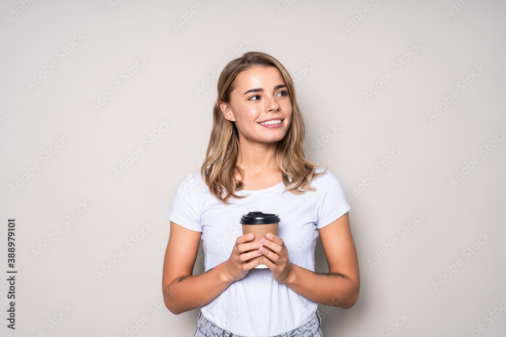 Young beautiful woman with cup of coffee isolated on white background Young beautiful woman with cup of coffee isolated on white background
