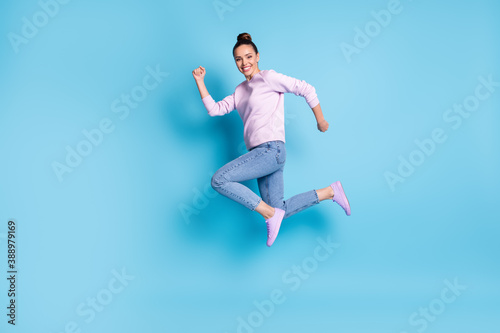 Full length body size profile side view of her she nice attractive pretty lovely cheerful cheery girl jumping running sprint marathon isolated bright vivid shine vibrant blue color background