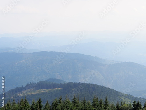 view from the Lysa hora mountain of the mountain landscape on a sunny summer day  hiking and traveling