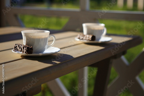 Fototapeta Naklejka Na Ścianę i Meble -  morning coffee with chocolate on the terrace