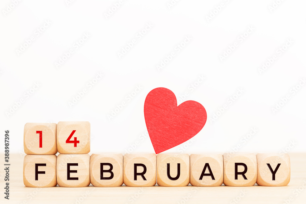 14 february text on wooden blocks and heart shaped on table. Valentines day concept