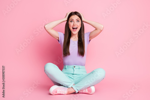 Canvas Print Full size photo of astonished positive girl sit floor legs crossed impressed won