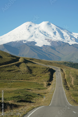 The road goes to huge mountain Elbrus