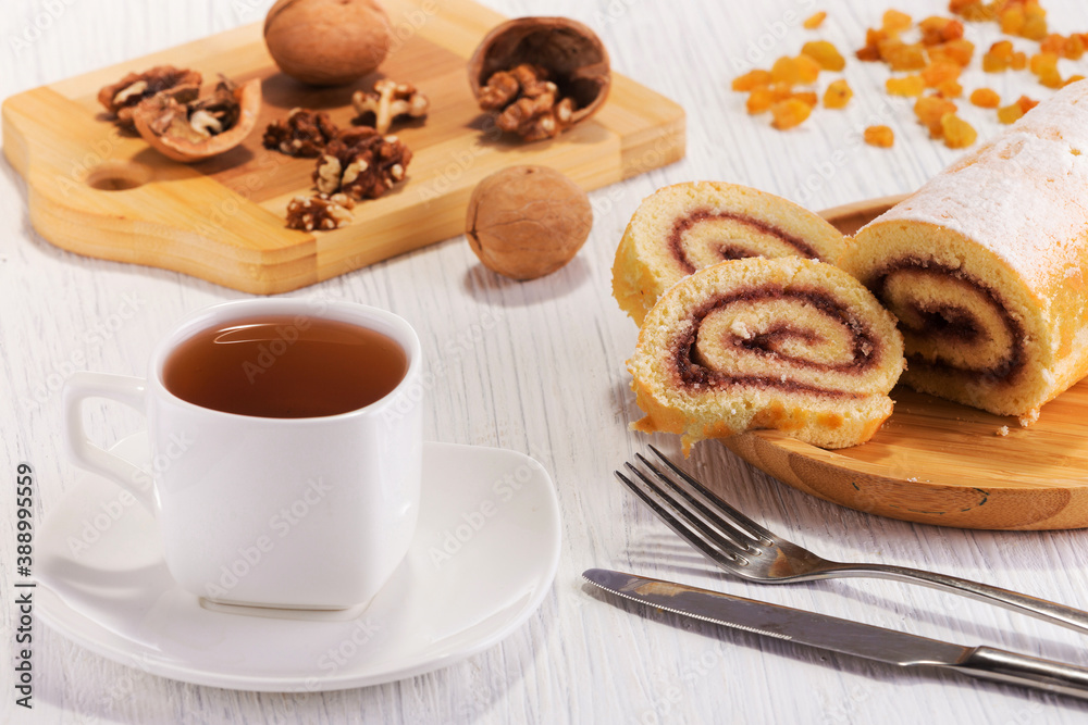 fine fresh baked roll with tea and walnuts