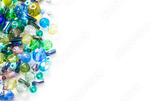 Lot of different glass beads, seed beads on white background