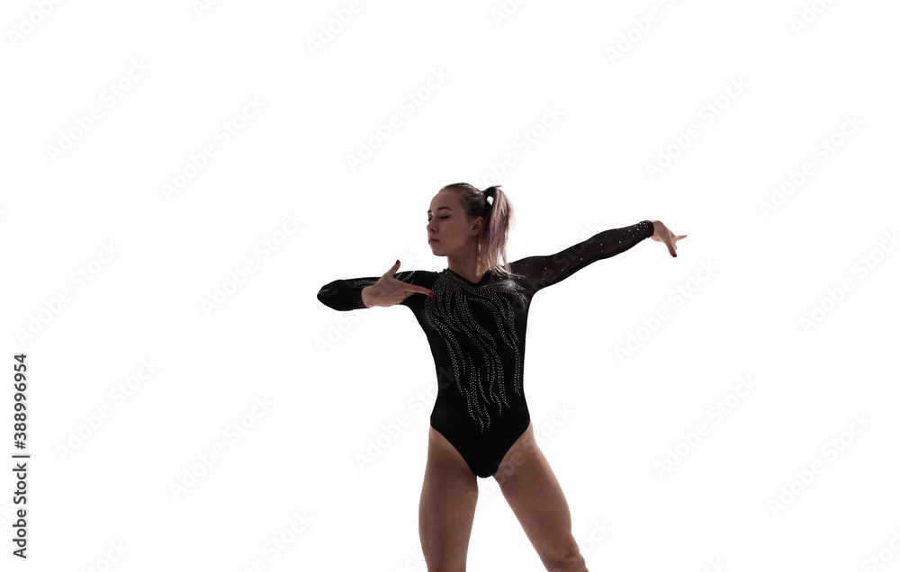 Female gymnast doing a complicated trick isolated on white.