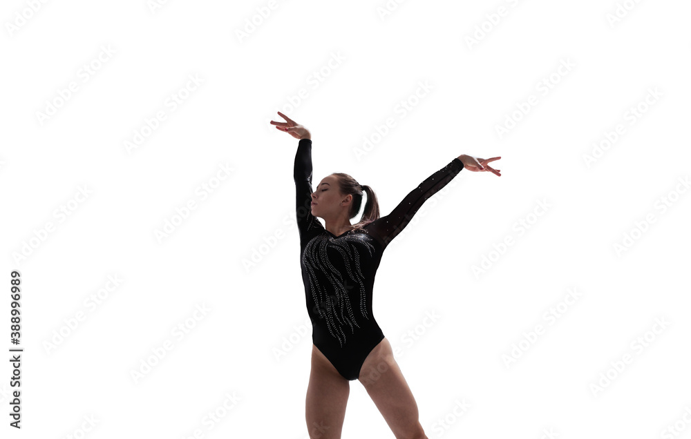 Female gymnast doing a complicated trick isolated on white.