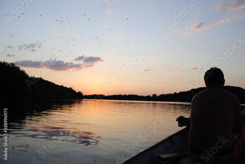 silhouette of a person sitting on a boat © Kristina P