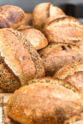 Various rustic bread on a wooden board. Healthy food and farming concept