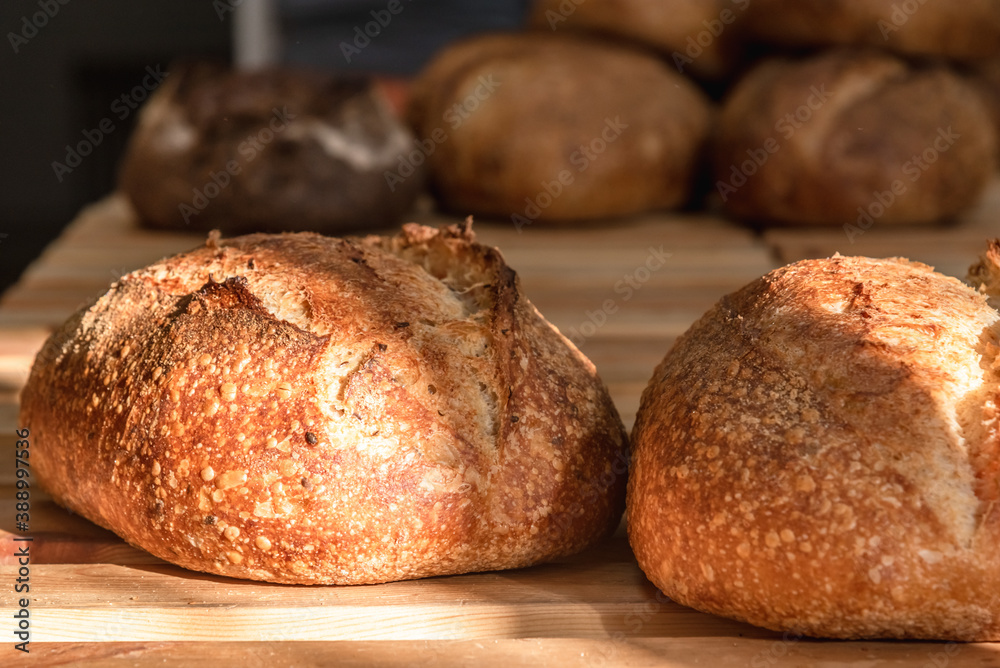 Various rustic bread on a wooden board. Healthy food and farming concept