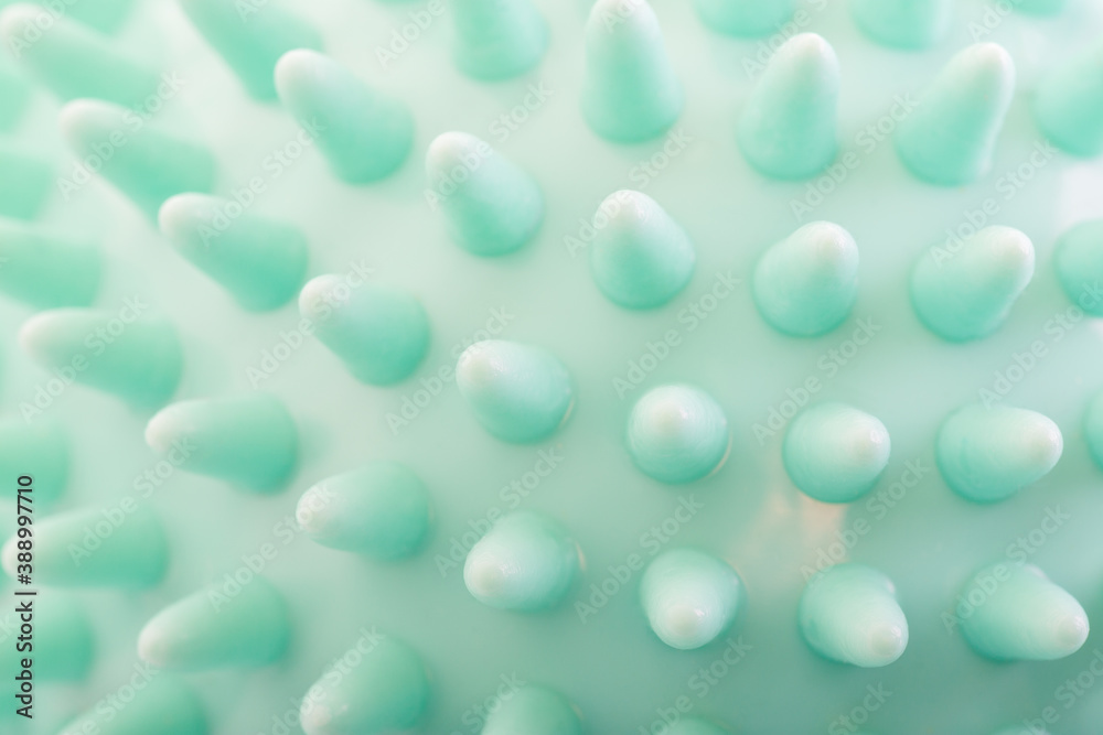 Super close-up of a massage ball, used in yoga, pilates and for sports injuries. Super close-up of a massage ball, used in yoga, pilates and for sports injuries.