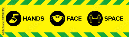 Hands Face Space Warning Sign with Icons for Covid-19 Coronavirus Social Distancing with face mask facemask face covering icon, wash hands icon, 2m distancing space icon. 