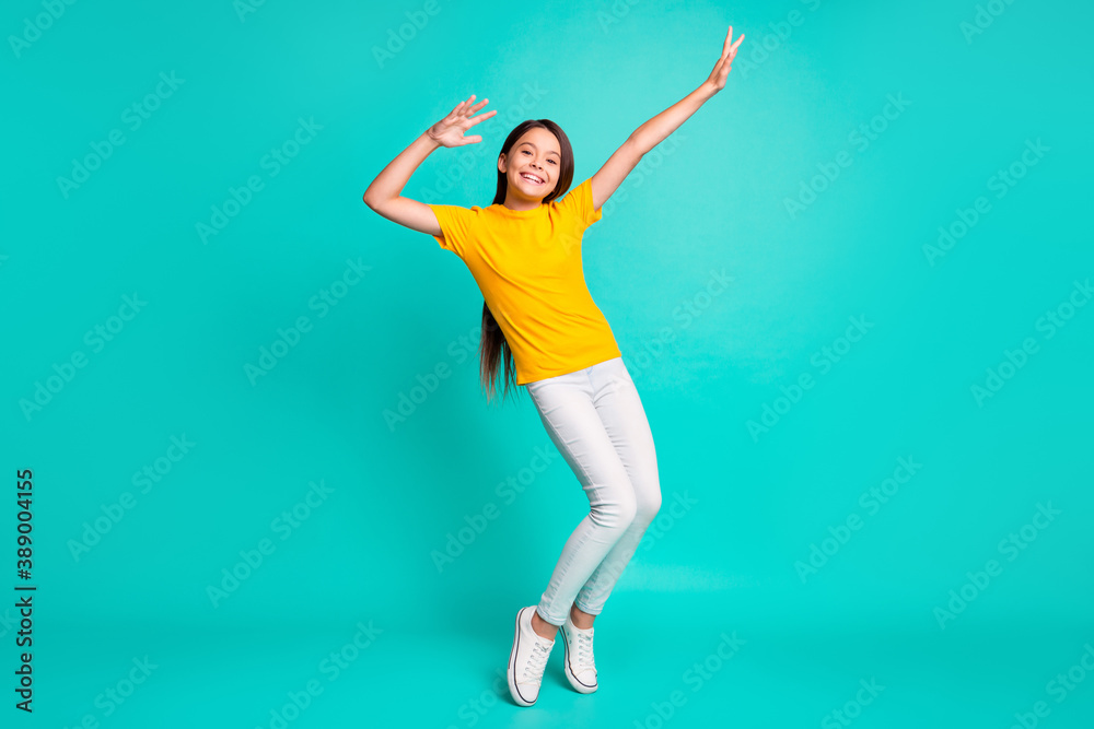 Obraz premium Full body photo of cool kid girl dancing wear casual style clothes isolated over turquoise color background