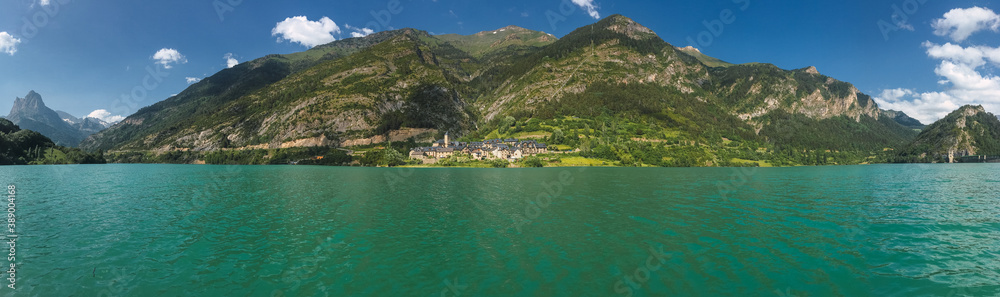 Mountain lake with a village in the background