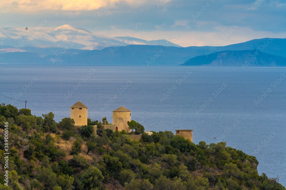 Ancient windmills in the midst of beautiful seaside landscapes along the southern shores of the Peloponnese Peninsula, Greece