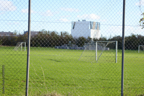 A empty green soccer field on a sunny day