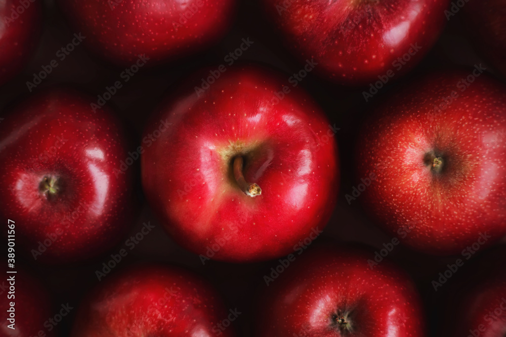 Top view of red delicious ripe garden sweet apples. Rich harvest of delicious fruits. Vegetarianism. Top view of red delicious ripe garden sweet apples. Rich harvest of delicious fruits. Vegetarianism.