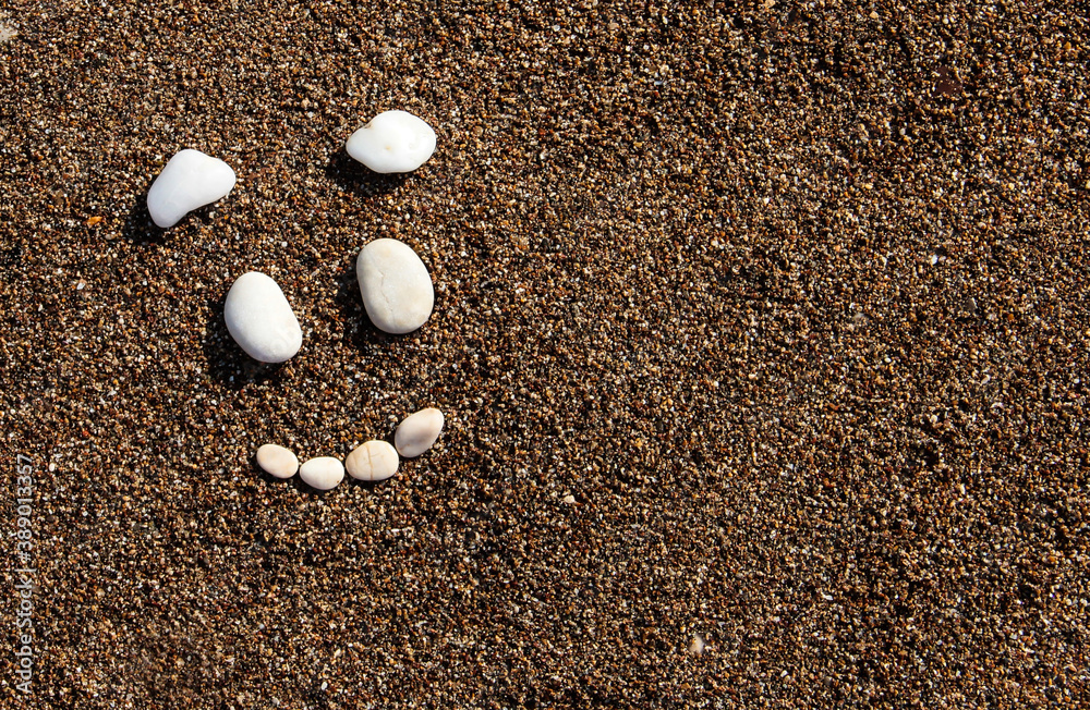 Smile on the sand. Funny face. Face of white stones. Smile on the sand. Funny face. Face of white stones.