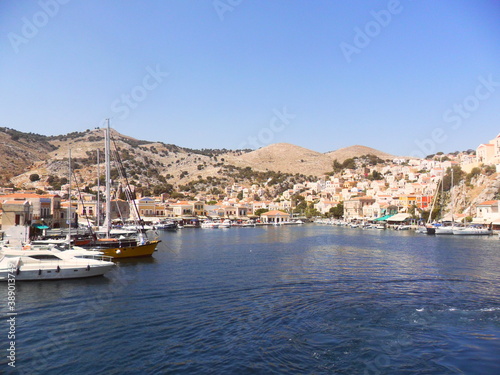 Fototapeta Naklejka Na Ścianę i Meble -  Sailing between the greek islands of Samos, Patmos, Lipsi, Leros, Kalymnos, Kos, Symi and Rhodes in Greece's Mediterranean Sea