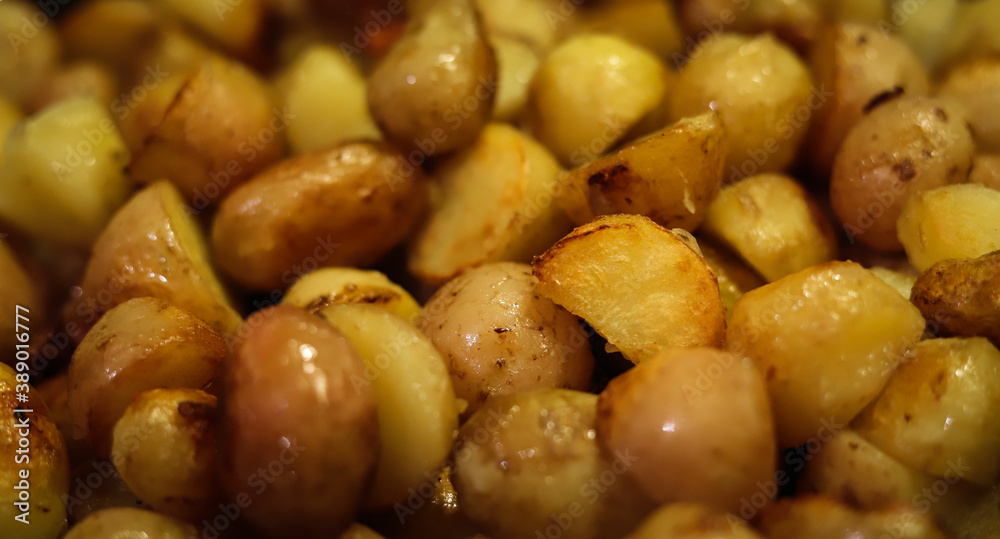 background of Golden fried new potatoes close-up background of Golden fried new potatoes close-up