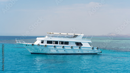 White private motor yacht in the blue sea © viktoriya89